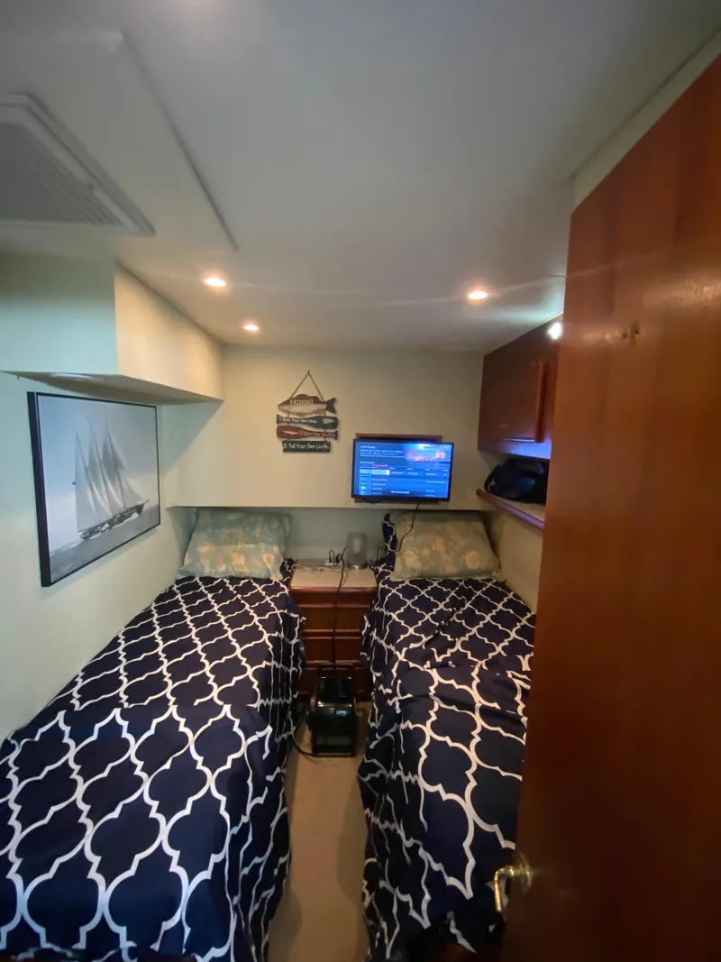 Slide: The Image of Interior cabin of 1988 Ocean Yachts 55 Super Sport with twin beds and nautical decor. - 24