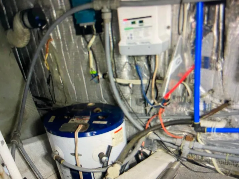 Slide: The Image of Engine room of 1988 Ocean Yachts 55 Super Sport with wiring and equipment. - 35