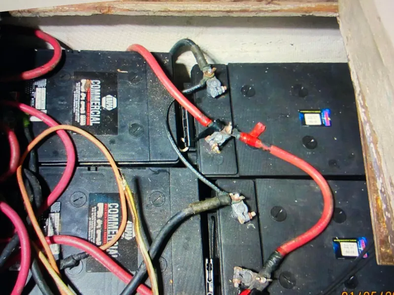 Slide: The Image of Battery compartment of 1988 Ocean Yachts 55 Super Sport with connected cables. - 36