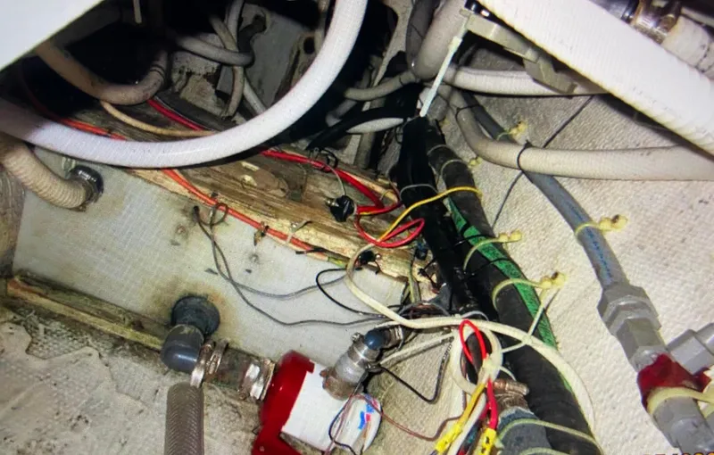 Slide: The Image of Engine room wiring and plumbing of 1988 Ocean Yachts 55 Super Sport boat. - 38