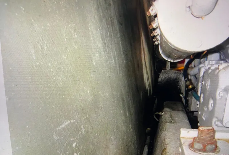 Slide: The Image of Engine room of 1988 Ocean Yachts 55 Super Sport, showcasing machinery and components. - 47