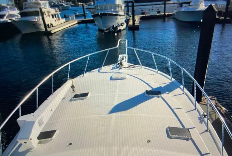 Slide: The Image of 1988 Ocean Yachts 55 Super Sport docked at marina, view from bow. - 8