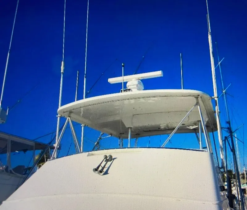 Slide: The Image of 1988 Ocean Yachts 55 Super Sport with radar, blue sky background. - 9