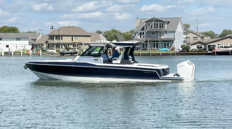 Slide: The Image of 2025 Formula 387 Center Console Fish boat cruising on a calm river. - 0