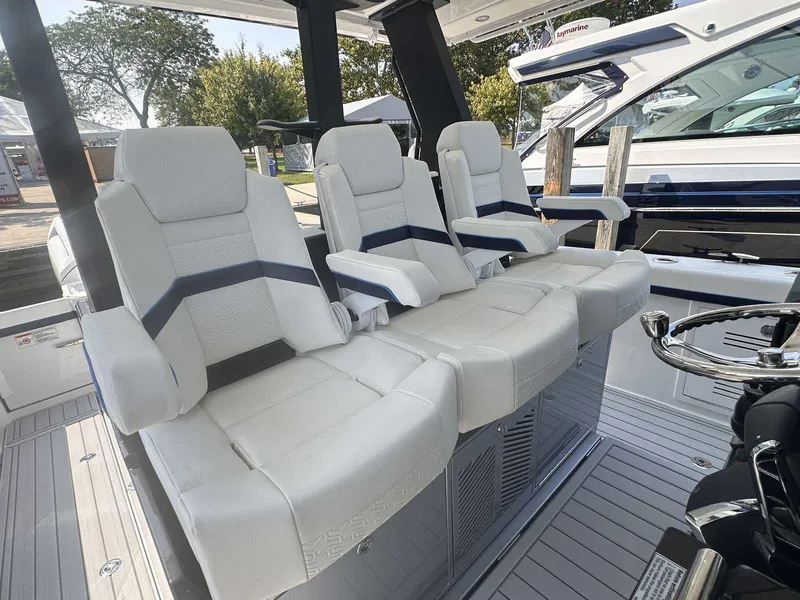 Slide: The Image of 2025 Formula 387 Center Console Fish boat interior with seating and storage compartments. - 19