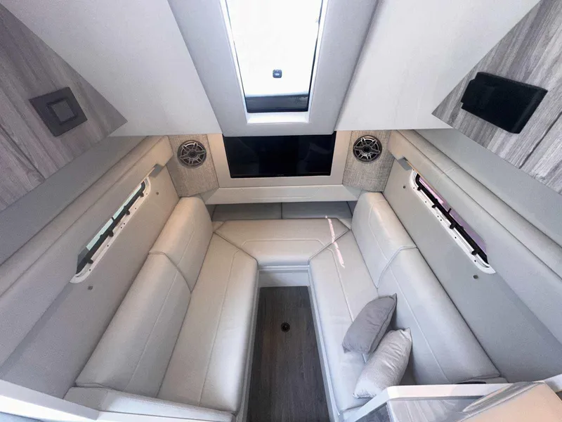 Slide: The Image of 2025 Formula 387 Center Console Fish boat with stainless steel ladder and dual propellers. - 2