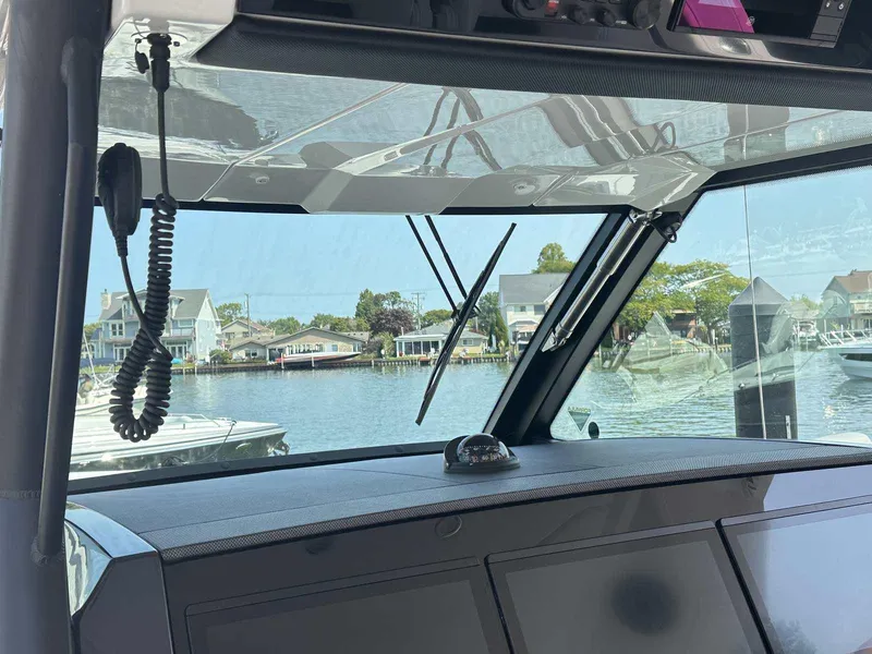 Slide: The Image of 2025 Formula 387 Center Console Fish boat interior with advanced navigation system and sleek design. - 31