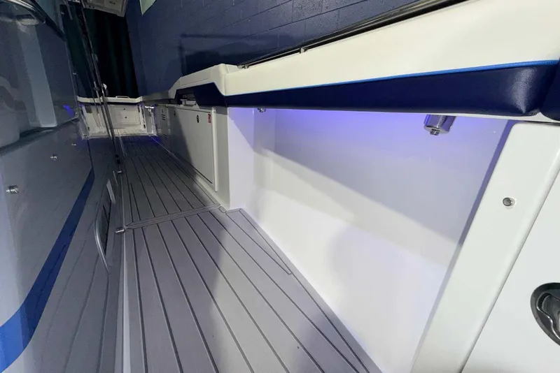 Slide: The Image of 2025 Formula 387 Center Console Fish boat interior with sleek design and ambient lighting. - 49