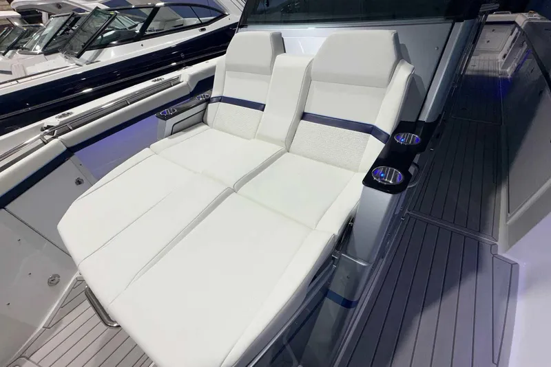 Slide: The Image of 2025 Formula 387 Center Console Fish boat with luxurious white seating and cup holders. - 54