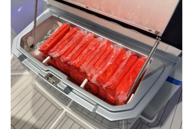 Slide: The Image of Storage compartment with life jackets on 2025 Formula 387 Center Console Fish boat. - 56
