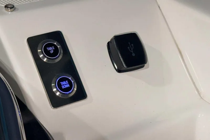 Slide: The Image of Control panel with table adjustment buttons and USB port on 2025 Formula 387 Center Console Fish. - 59