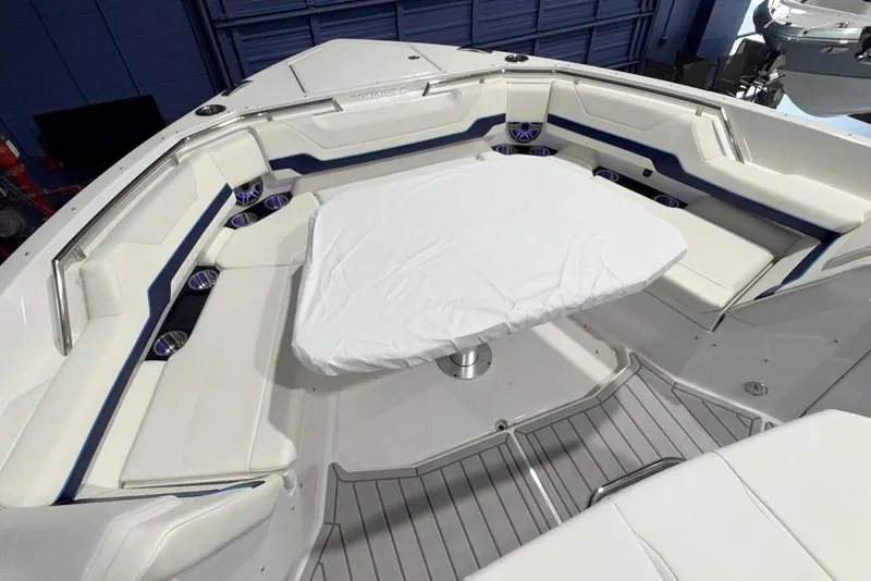 Slide: The Image of 2025 Formula 387 Center Console Fish boat interior with cushioned seating and table. - 61