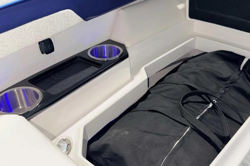 Slide: The Image of 2025 Formula 387 Center Console Fish interior with cup holders and storage compartment. - 65