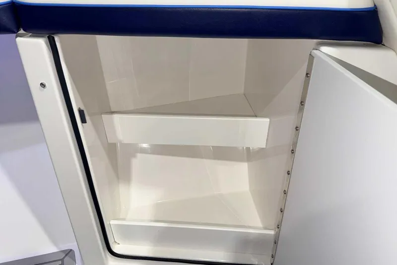 Slide: The Image of 2025 Formula 387 Center Console Fish storage compartment with open door. - 68