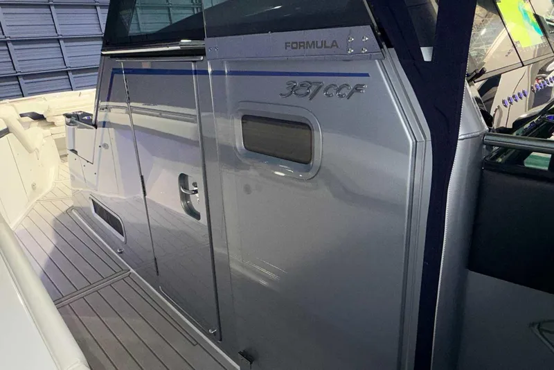 Slide: The Image of 2025 Formula 387 Center Console Fish boat, sleek design, docked indoors. - 70