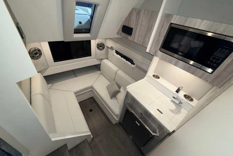 Slide: The Image of 2025 Formula 387 Center Console Fish interior with seating, kitchenette, and modern amenities. - 72