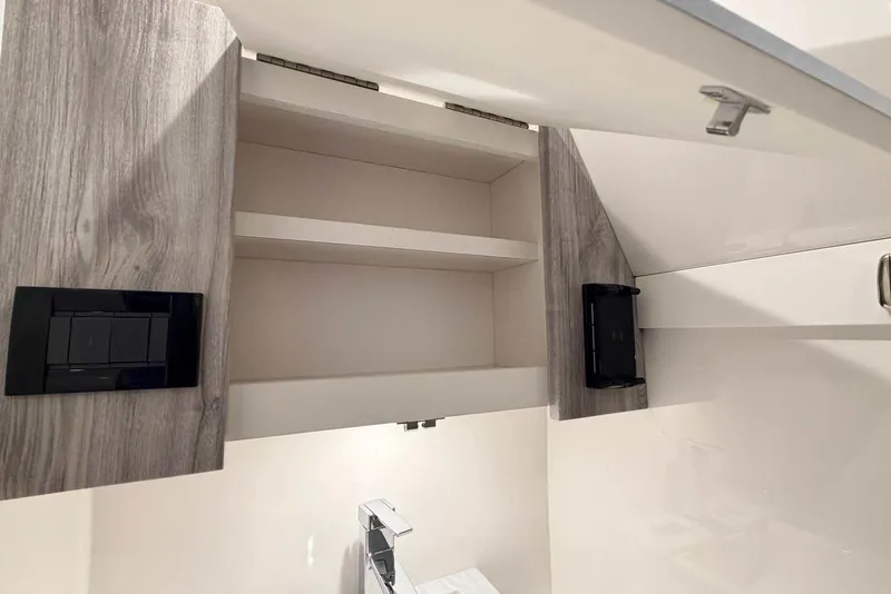 Slide: The Image of Open cabinet with shelves in 2025 Formula 387 Center Console Fish boat. - 78