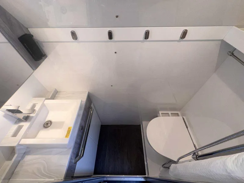 Slide: The Image of 2025 Formula 387 Center Console Fish boat in showroom, featuring sleek design and modern amenities. - 8