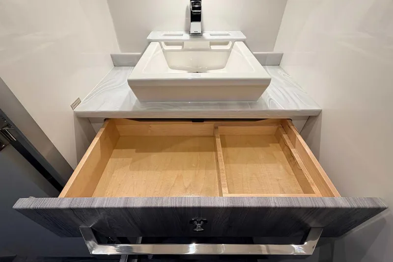 Slide: The Image of Open drawer beneath modern sink in 2025 Formula 387 Center Console Fish. - 87