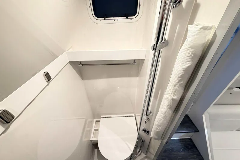 Slide: The Image of 2025 Formula 387 Center Console Fish boat bathroom with modern fixtures and compact design. - 89