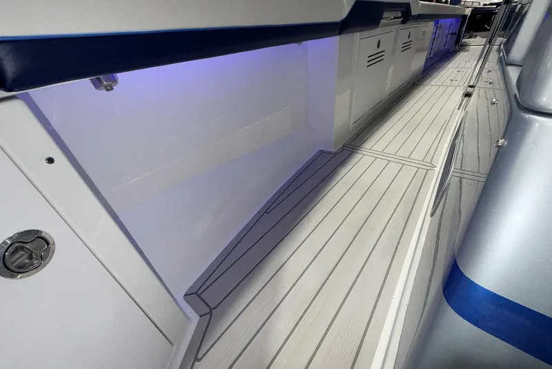 Slide: The Image of 2025 Formula 387 Center Console Fish boat interior with sleek flooring and ambient lighting. - 92