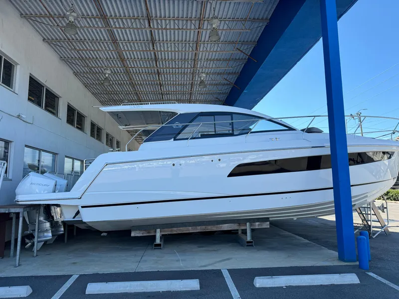 Slide: The Image of 2024 Sealine S335V yacht displayed in a covered marina area. - 1