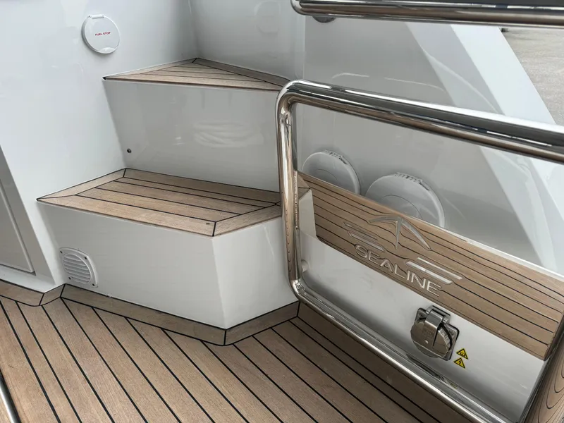 Slide: The Image of 2024 Sealine S335V yacht with teak deck and stainless steel railing. - 11