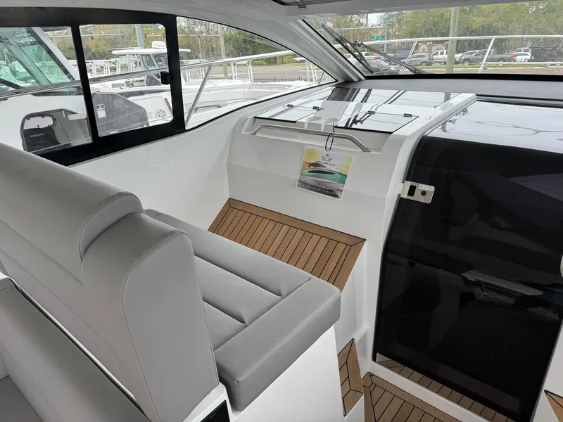 Slide: The Image of 2024 Sealine S335V yacht interior with sleek seating and modern design. - 16