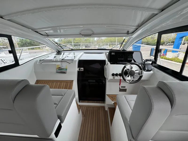 Slide: The Image of Interior of 2024 Sealine S335V boat with modern helm and seating. - 17