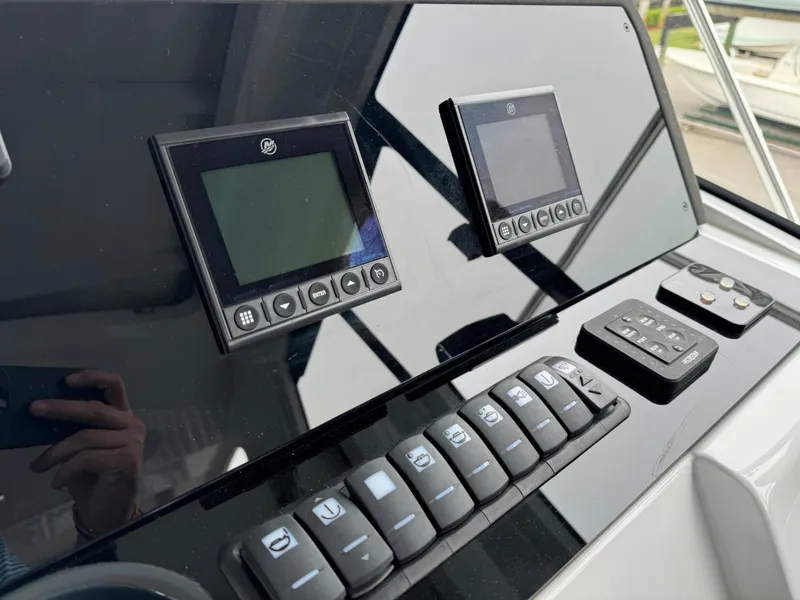 Slide: The Image of 2024 Sealine S335V dashboard with modern controls and digital displays. - 19