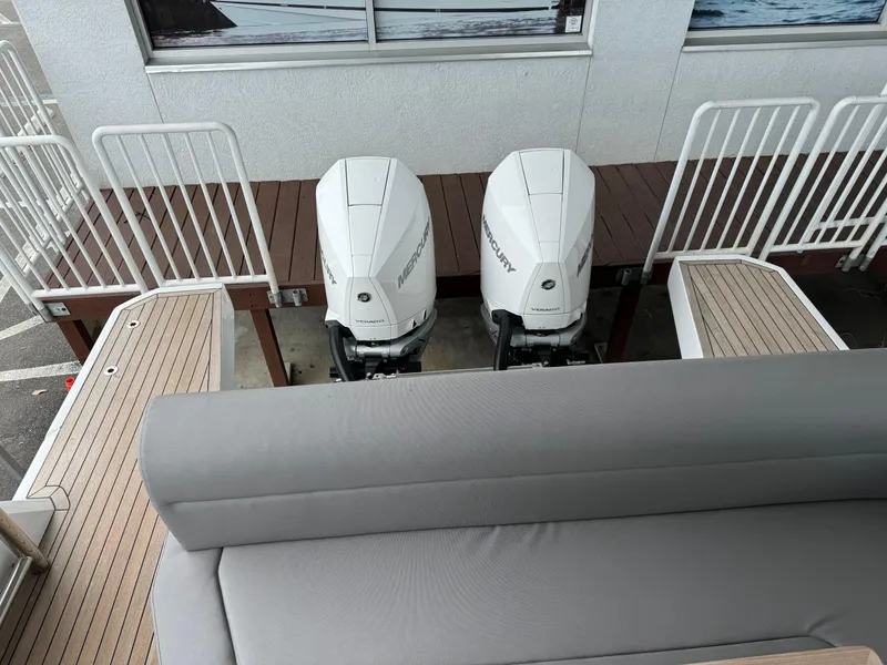 Slide: The Image of 2024 Sealine S335V boat with dual outboard engines, rear view. - 33