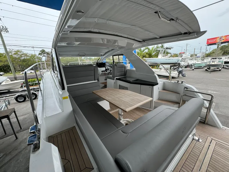 Slide: The Image of 2024 Sealine S335V yacht interior with sleek seating and modern design. - 9