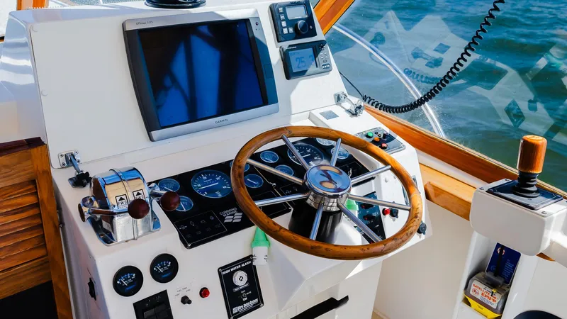 Slide: The Image of Control panel of 1998 Little Harbor WhisperJet 38 boat with wooden steering wheel. - 15