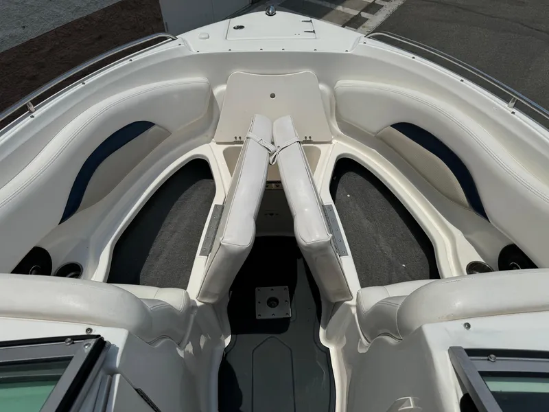 Slide: The Image of 2009 Chaparral SSX 236 boat interior with white seating and carpeted flooring. - 10