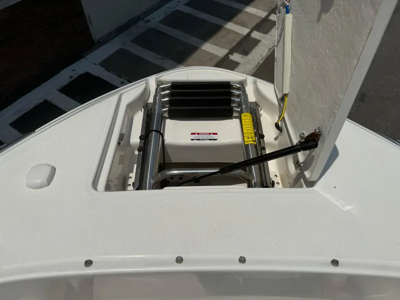 Slide: The Image of 2009 Chaparral SSX 236 boat with open hatch and ladder. - 11