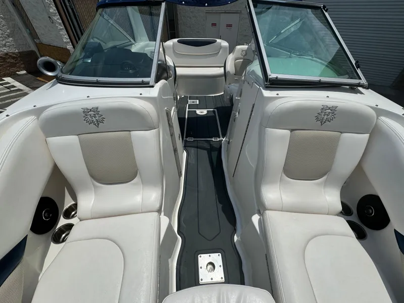 Slide: The Image of 2009 Chaparral SSX 236 boat interior with white seating and open cockpit design. - 12