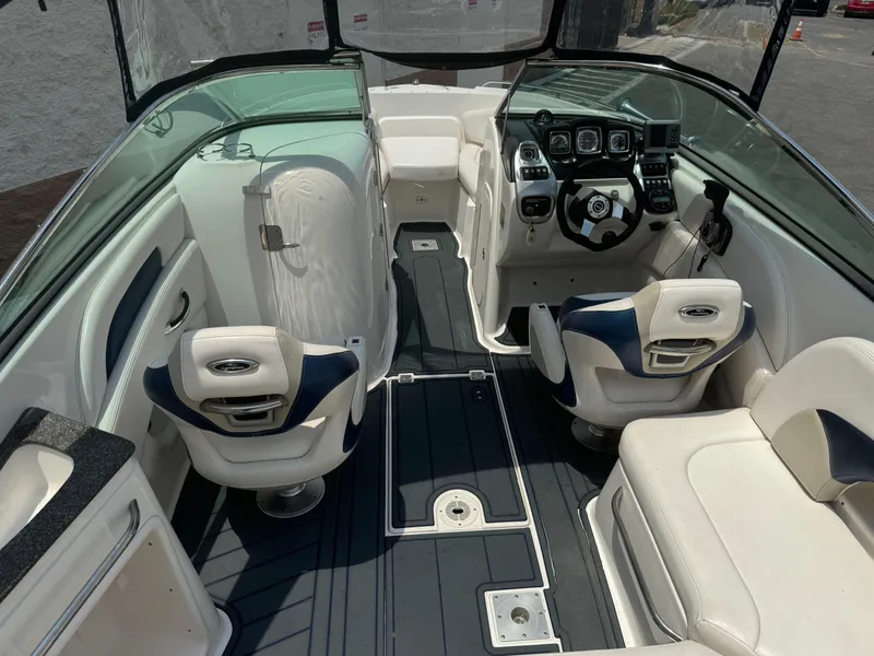Slide: The Image of 2009 Chaparral SSX 236 boat interior with steering wheel and seating. - 14