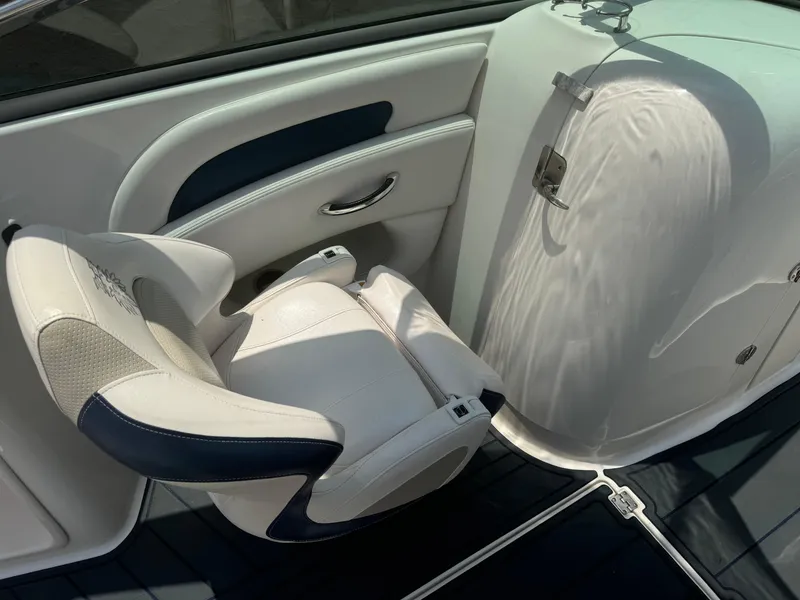 Slide: The Image of 2009 Chaparral SSX 236 boat interior with white and navy seating. - 16