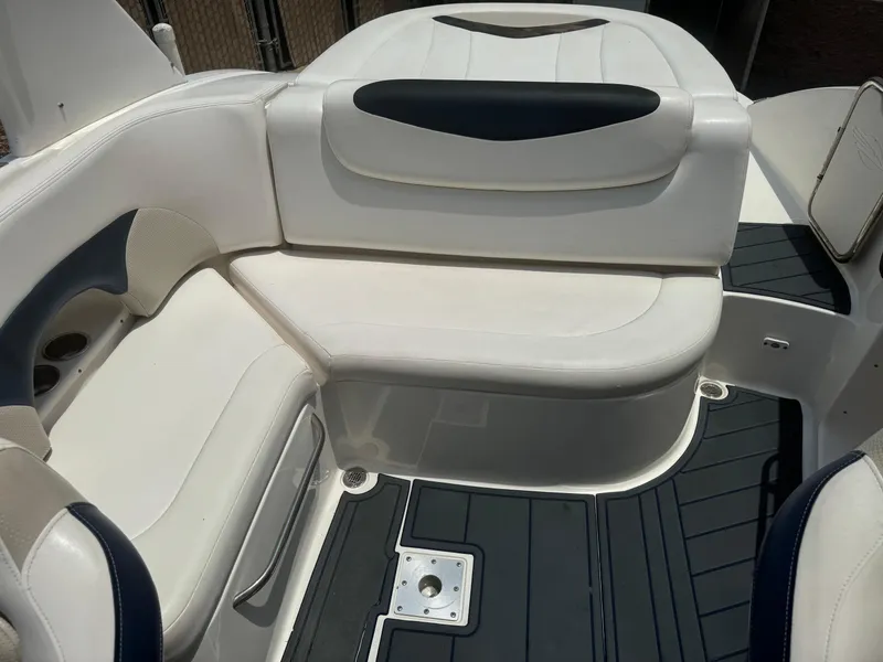 Slide: The Image of 2009 Chaparral SSX 236 boat interior with white seating and dark flooring. - 19