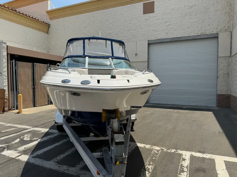 Slide: The Image of 2009 Chaparral SSX 236 boat on trailer in urban setting. - 2