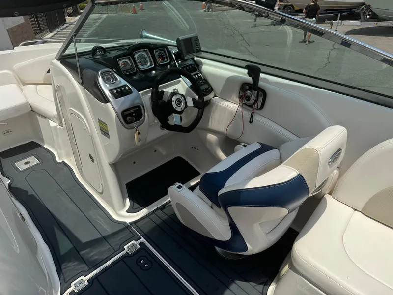 Slide: The Image of 2009 Chaparral SSX 236 boat interior with steering wheel and dashboard controls. - 20