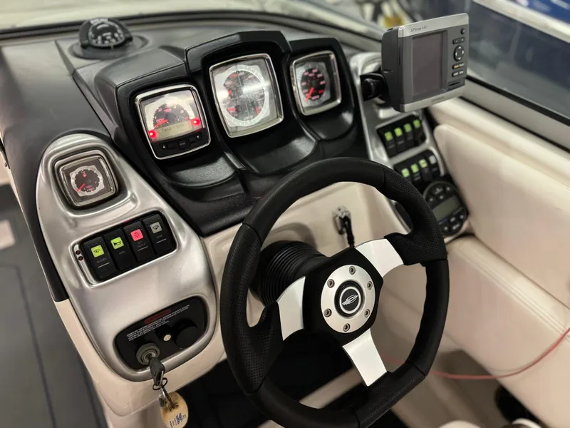 Slide: The Image of 2009 Chaparral SSX 236 dashboard with steering wheel and instrument panel. - 23