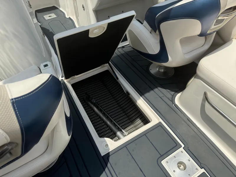 Slide: The Image of 2009 Chaparral SSX 236 boat interior with open storage compartment and seating. - 25