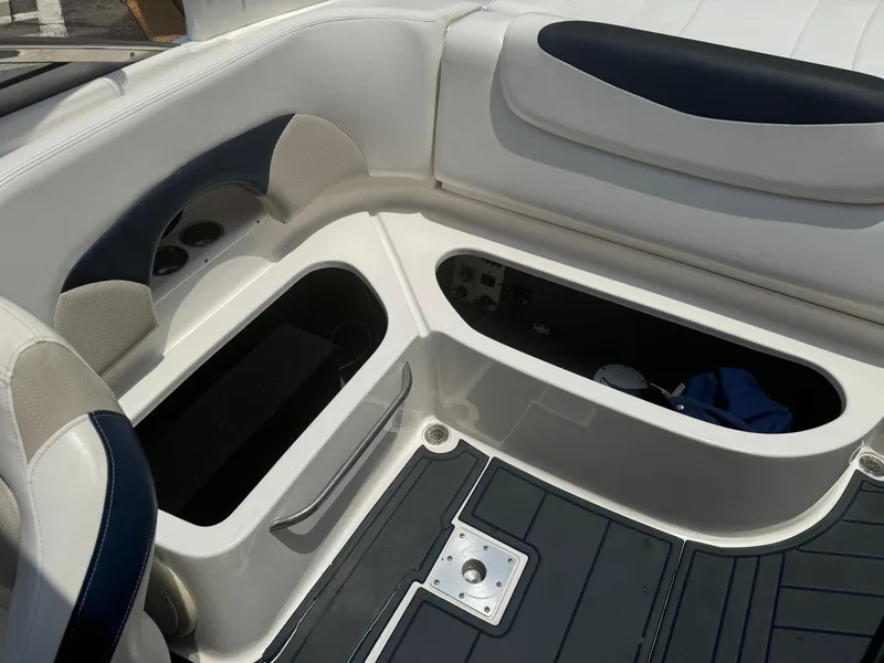 Slide: The Image of 2009 Chaparral SSX 236 boat interior with open storage compartments. - 26