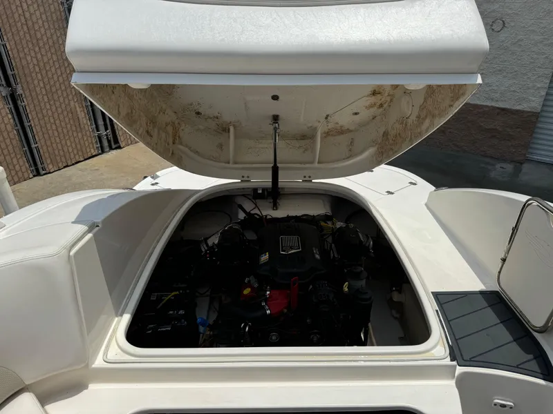 Slide: The Image of Open engine compartment of 2009 Chaparral SSX 236 boat, showcasing internal components. - 27
