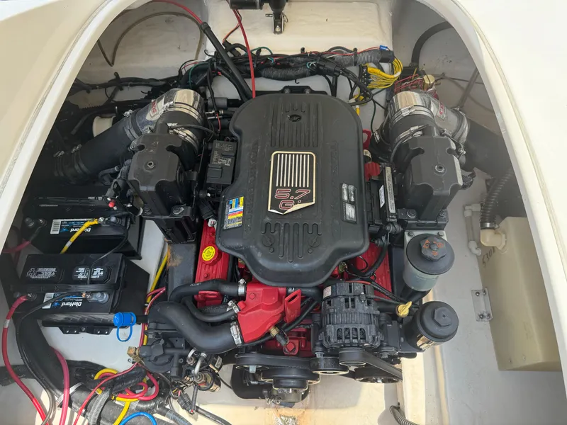 Slide: The Image of Engine compartment of 2009 Chaparral SSX 236 boat, featuring a powerful engine setup. - 28