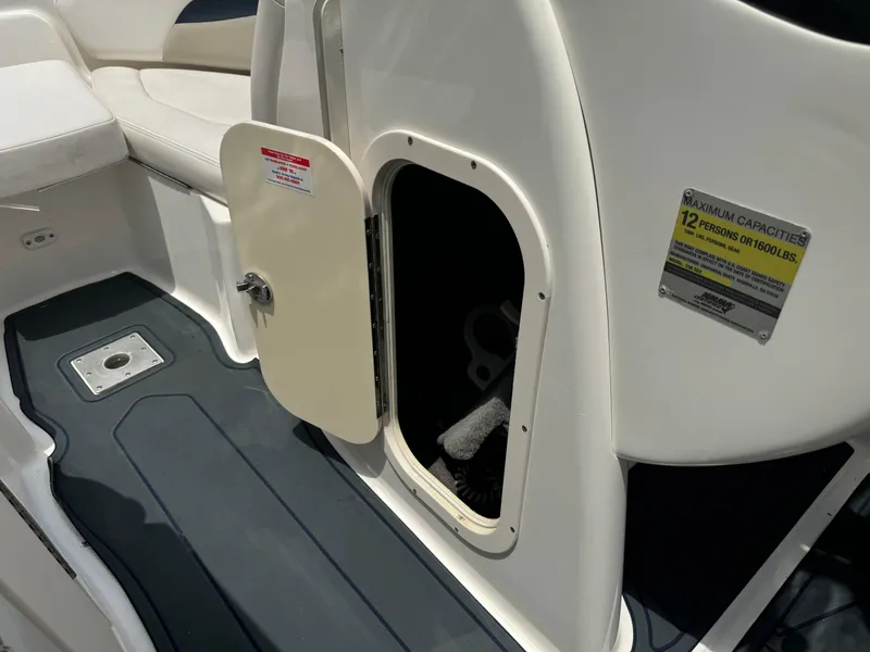 Slide: The Image of 2009 Chaparral SSX 236 boat interior with open storage compartment and seating. - 29