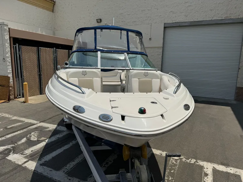 Slide: The Image of 2009 Chaparral SSX 236 boat on trailer in parking lot. - 3