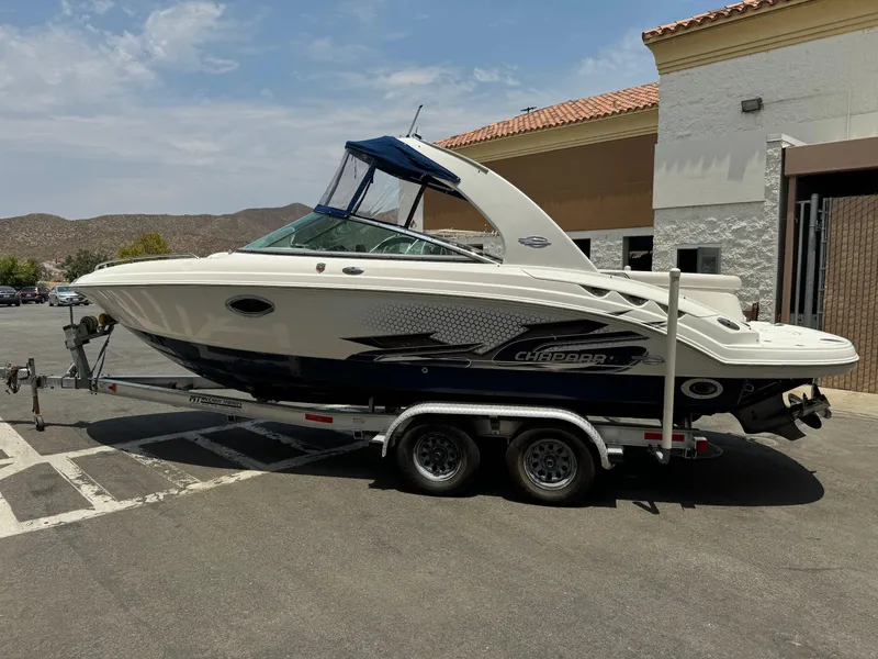 Slide: The Image of 2009 Chaparral SSX 236 boat on trailer in parking lot. - 6