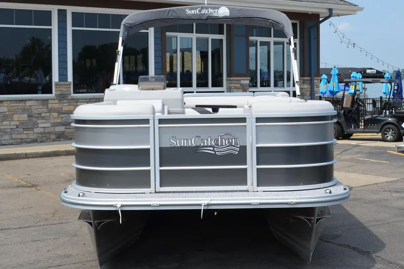 Slide: The Image of 2021 SunCatcher Select Series 20c pontoon boat parked at marina. - 10